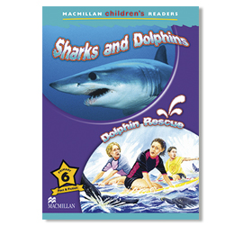 Image of a children's reading book called Sharks and Dolphins, with a series of dolphin rescue books. A drawing of a blue shark and a dolphin. Two children are shown on the beach watching the sea.