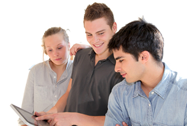 three young people, a boy and two girls, are watching a digital tablet.